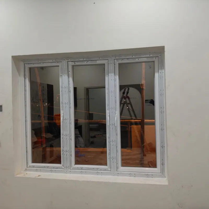 White uPVC window installed in a room under renovation