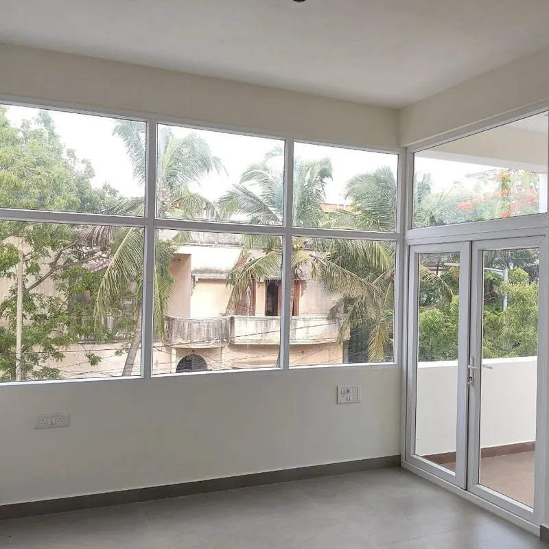 White fixed glazing and a glazed balcony door
