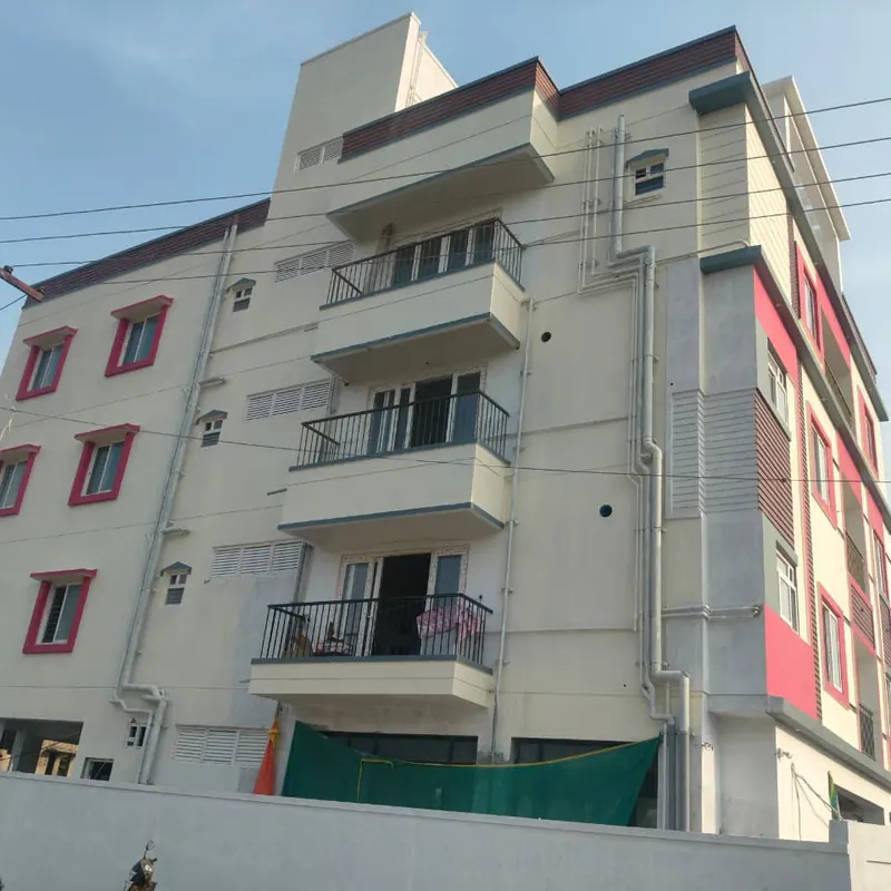 Apartment block corner with white framed windows