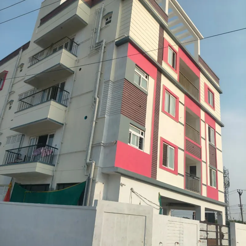 Apartment facade with white windows and balconies