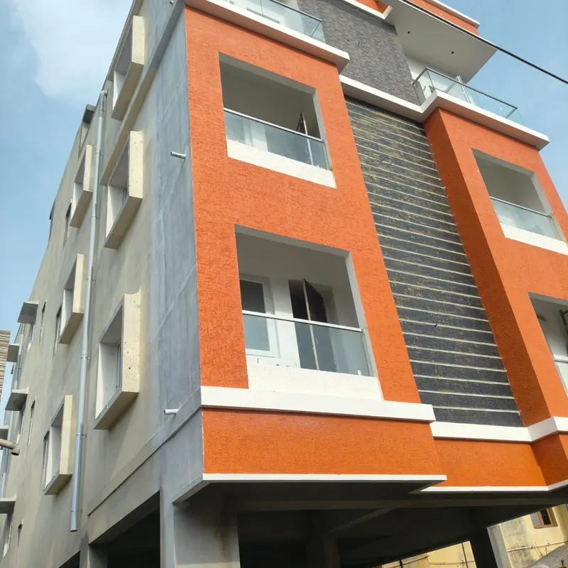 Orange and grey building with white windows